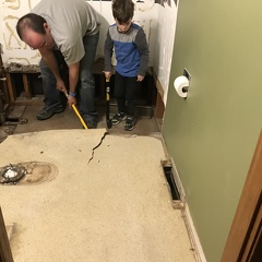 Ripping up floor in bathroom - right before pipe broke
